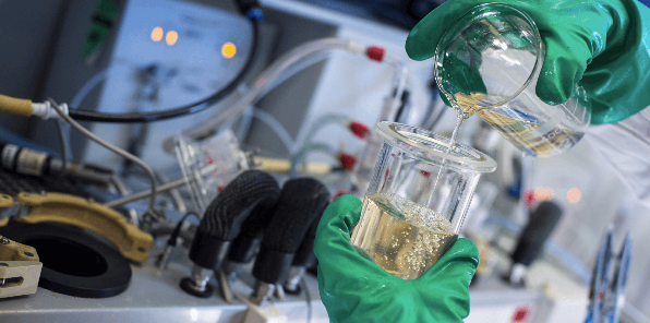 Healthcare research with beaker in the lab